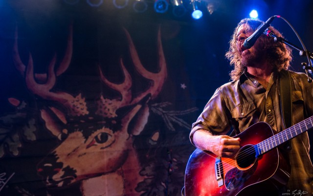 The White Buffalo & Chuck Ragan – April 12th – Gothic Theatre Bearded and tattooed men filled into the Gothic Theatre last Saturday night for a dual-headlining show with rowdy rockers The White Buffalo and Chuck Ragan & the Camaraderie. The beer went down like water but the crowd energy didn’t quite reflect it. Based on White Buffalo shows past, many in the crowd had their papers in order in case they didn't make it out of this one alive, but it turned out that wasn’t necessary.