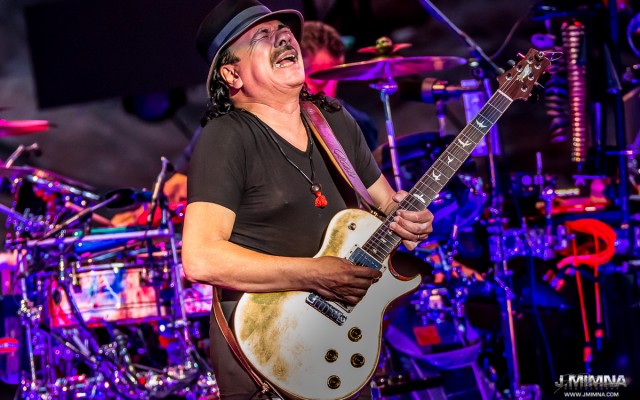 Santana – July 10th – Red Rocks Amphitheatre Carlos Santana played Red Rocks last Monday like he has so many times before. Billed as "A Night with Carlos Santana," the overcast, wet night was filled with the hits, giant guitar solos, and the epic American songs that define Santana's legacy. The night was truly a treat for fans and Carlos alike, as his love of the hallowed venue is no secret as he elaborated in his forward written for the new book Red Rocks - The Concert Years by G. Brown.